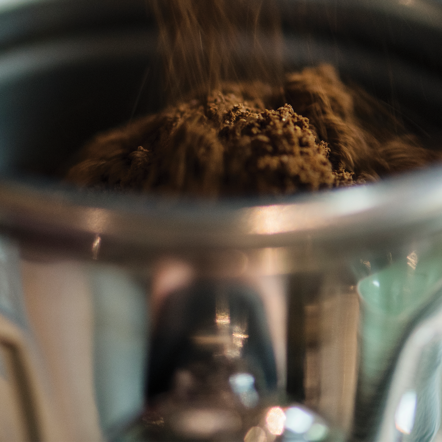 Photo of rows of school desk chairs in a classroom.