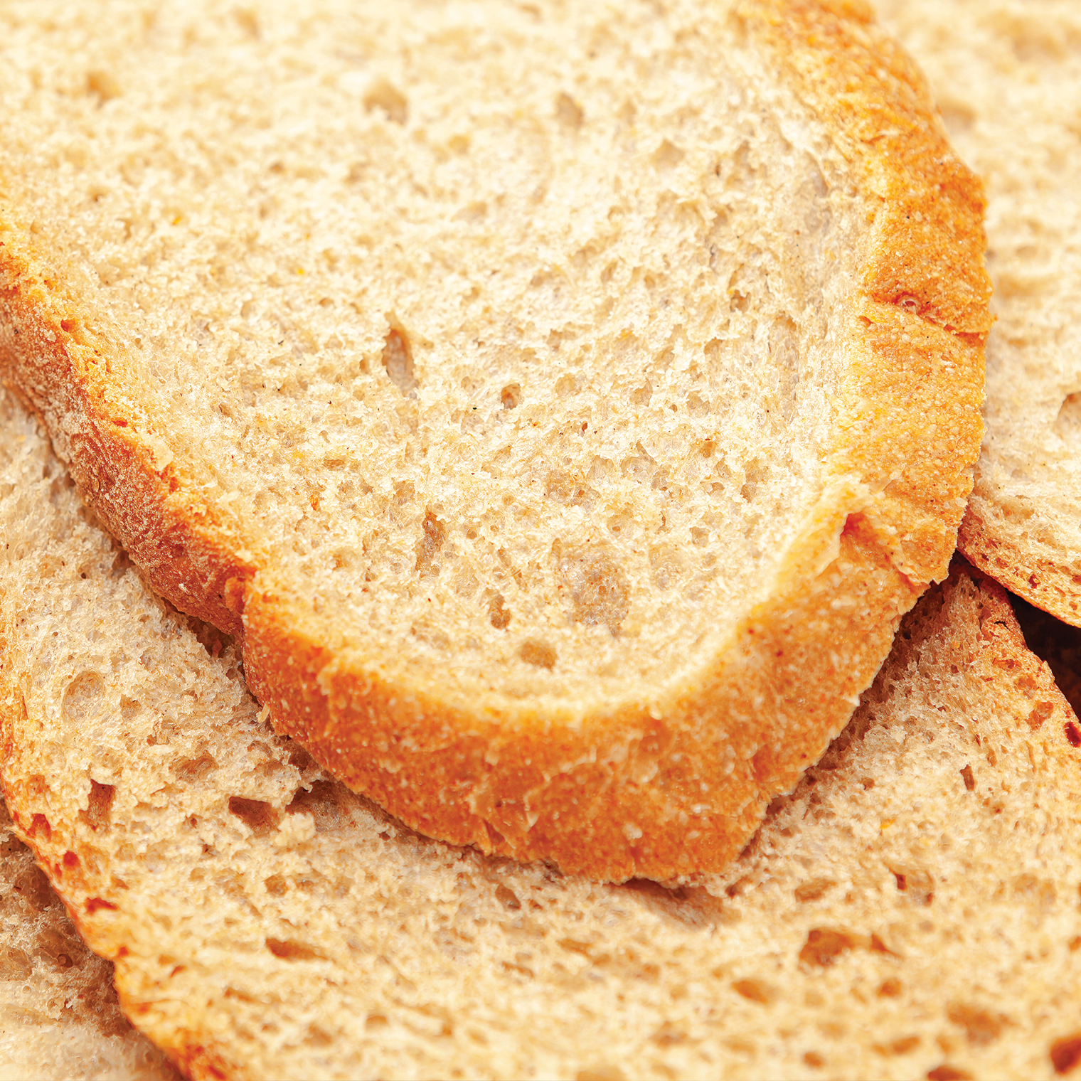 Photo of rows of school desk chairs in a classroom.